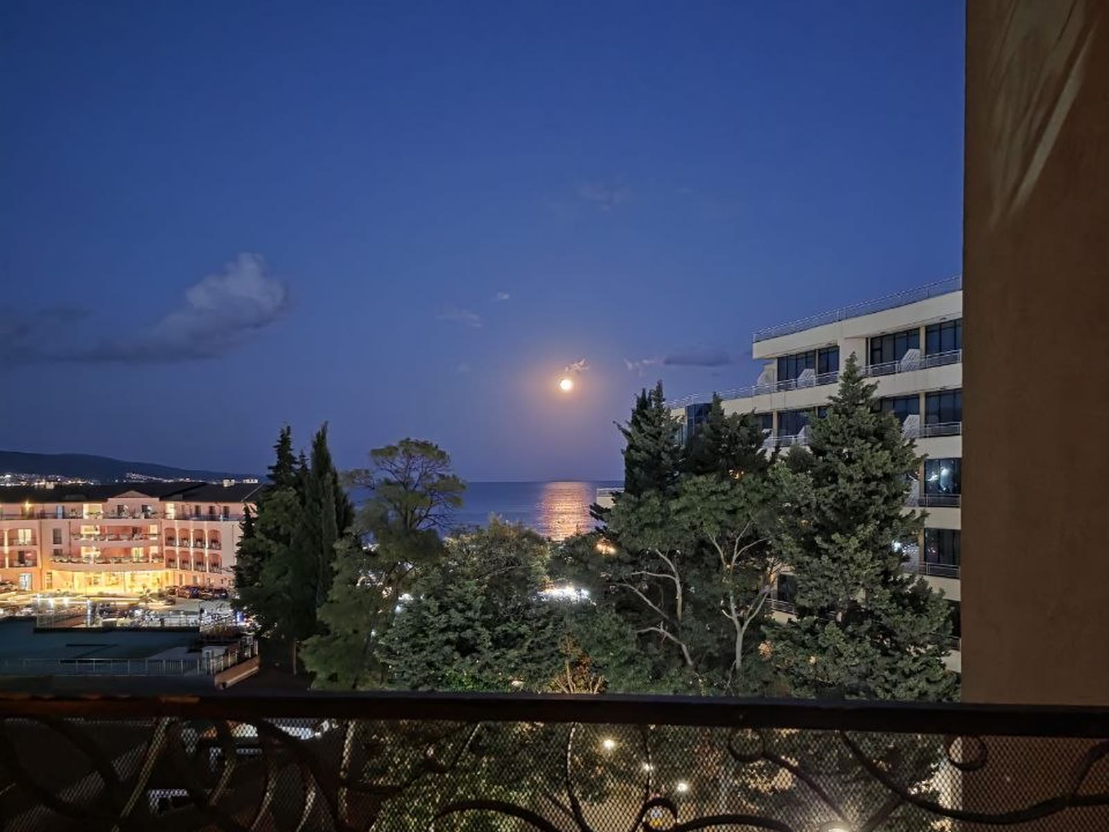 The evening moon over the sea from the balcony